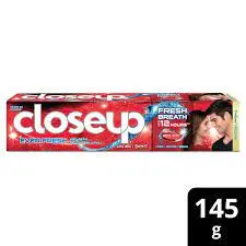 close up red hot tooth paste